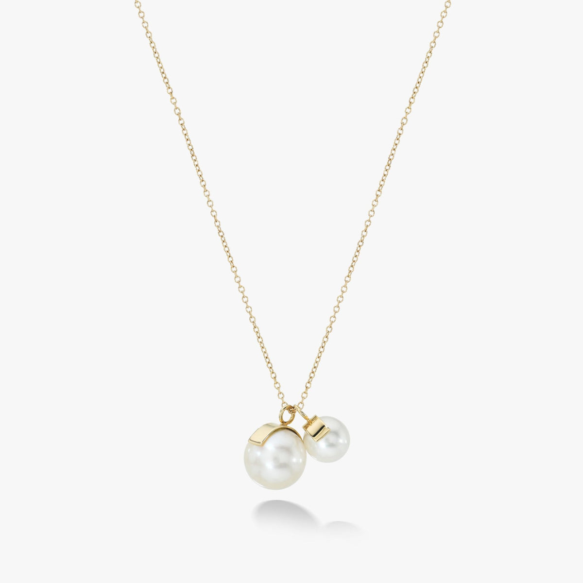 The Aalto Duo Necklace by White Space Jewelry, featuring freshwater pearls and 14k gold.