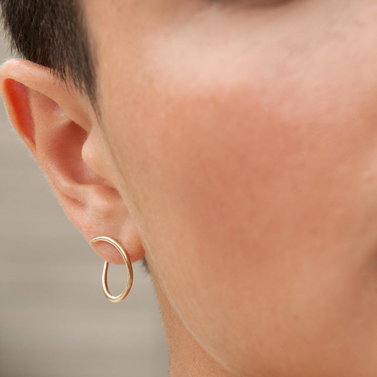Picture of Esme Loop Gold Hoop Earrings on body  White Space Jewelry